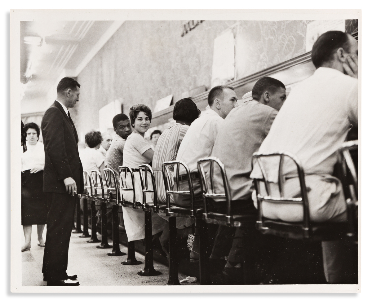 (CIVIL RIGHTS.) Pair of photographs of a CORE sit-in at a New Orleans Woolworths lunch counter.